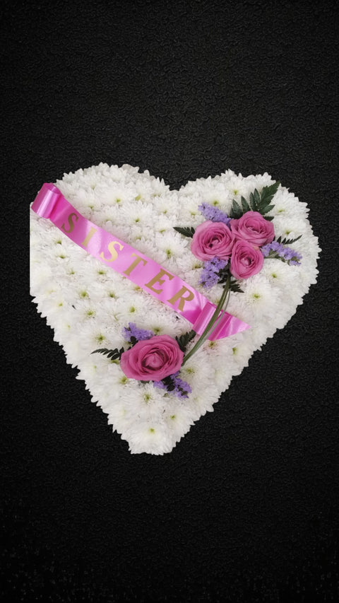 Solid White Heart Tribute with Ribbon Edge and Corner Spray  Description: